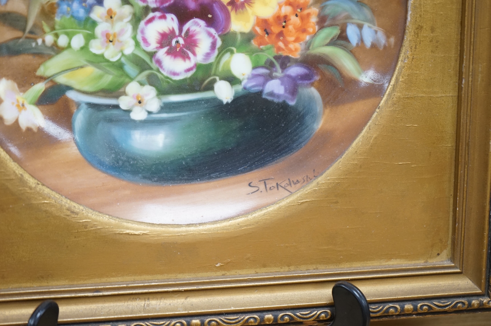 A pair of Noritake floral plates, signed S. Tokohashi, frames in gilt mounts and frames, plates 18.5cm diameter.